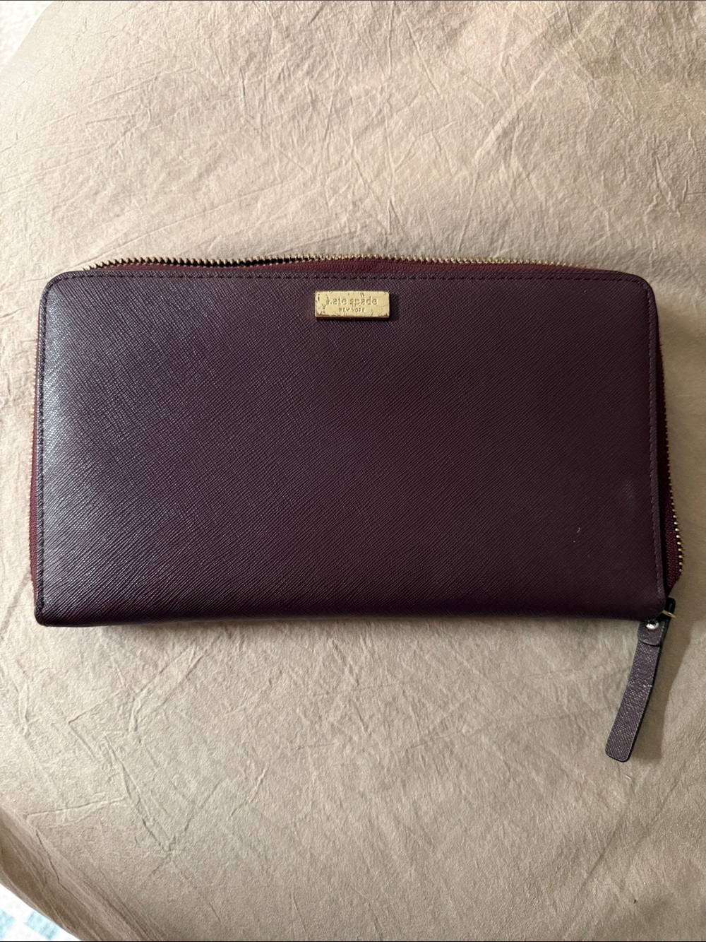 kate spade zip-around wallet in plum